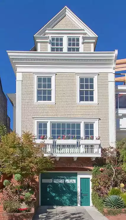 Distressed house in Lake Como quickly sold before foreclosure. Tan colored cedar shake siding home sold fast in Lake Como.